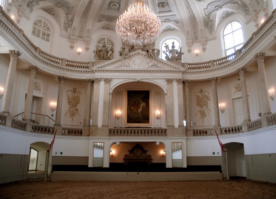 Performance Of The Lipizzans At Spanish Riding School - The Baroque Winter Riding School at Hofburg Palace: Where the Atmosphere Comes From